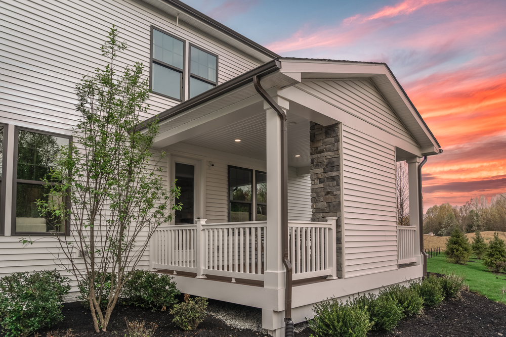 home with new exterior siding in white with durable fire resistant james hardie siding that is affordable and improves curb appeal and home value