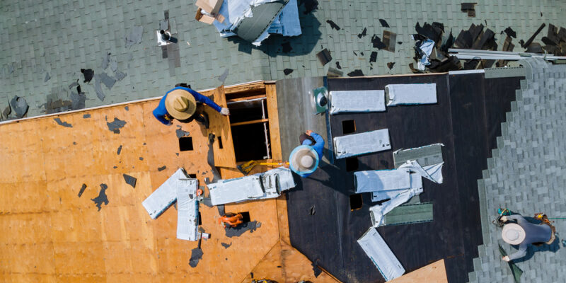 construction workers working on a new roof replacement remodeling service for a home that got inspected