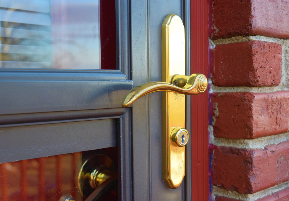 glass panel storm door installed in front entryway of home to protect it from the weather and intruders and increase the overall property value