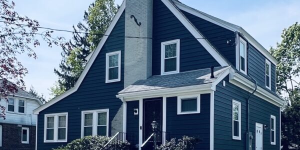 residential family home in belmont using everlast siding in color blue spurce with therma tru door and pvc trim by three sons window and door