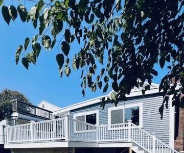 harvey slim line double hung window certainteed main street d4 siding pacific blue azek deck slate gray professional installed in watertown massachusetts by three sons window and door