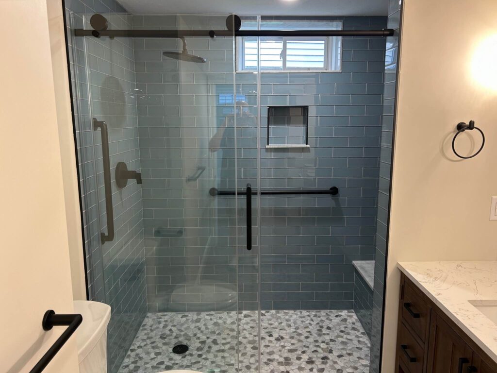 basement bathroom remodel new shower and tile floors and countertop with sink in framingham massachusetts by three sons window door