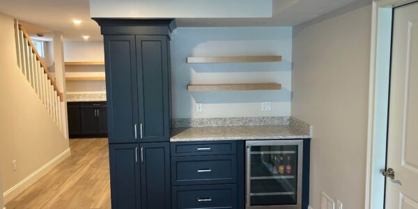 storage and built in shelving in full basement remodel new hardwood custom flooring in framingham massachusetts by three sons window door