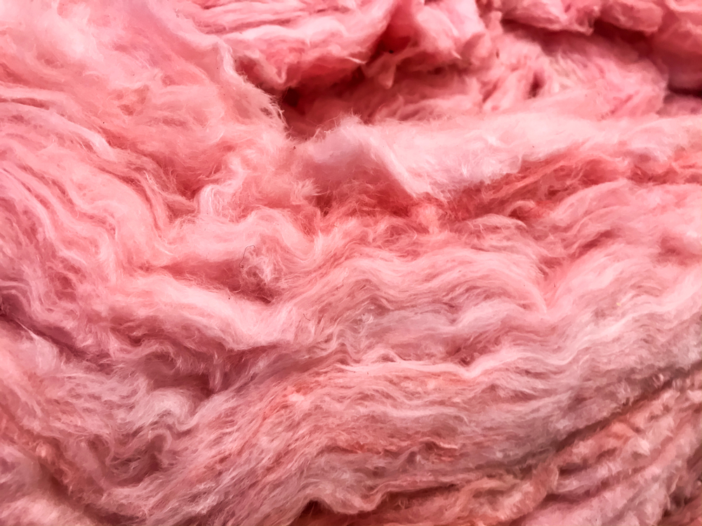 fiberglass insulation pink fluffy insulated material to be installed in home for improved efficiency