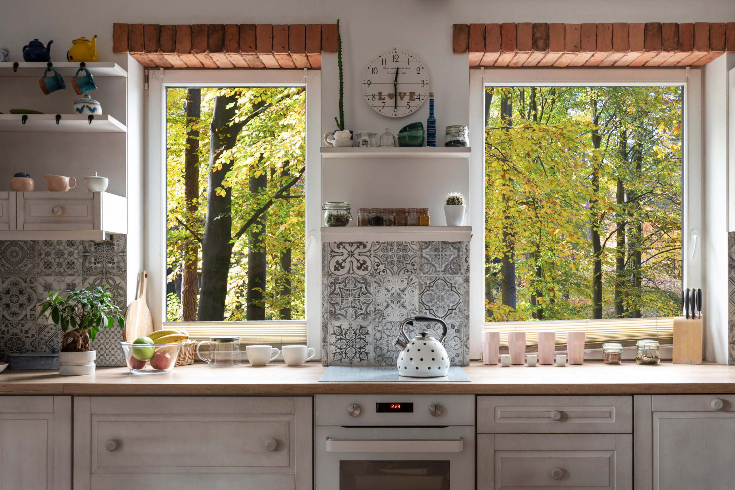 A kitchen featuring large windows