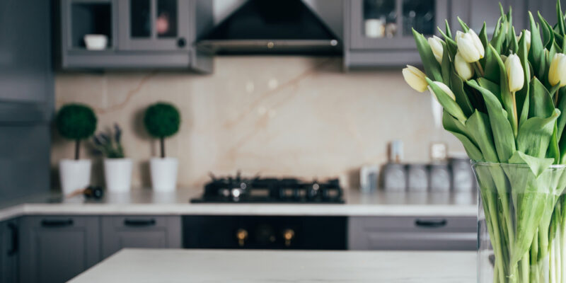 flowers in kitchen of home during the spring after renovating the house for national home improvement month