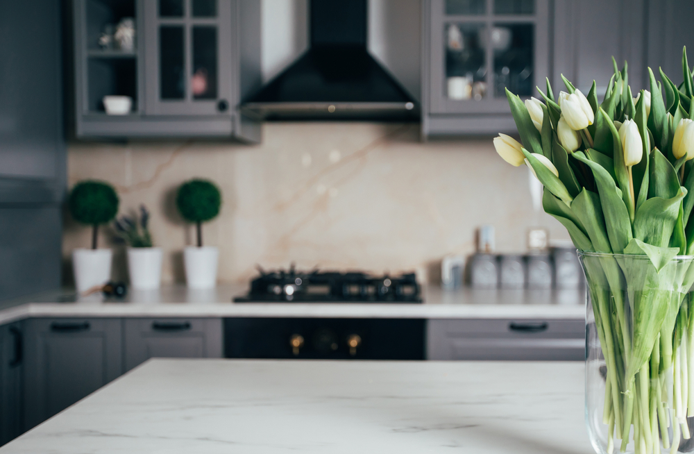flowers in kitchen of home during the spring after renovating the house for national home improvement month