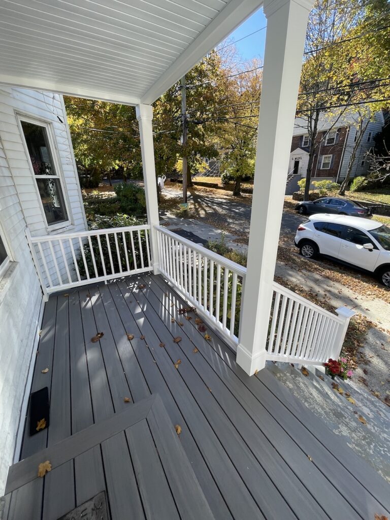 porch renovation with azek landmark decking in castle gate for home in arlington massachusetts by three sons window and door