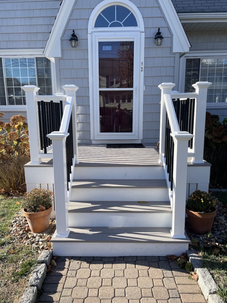 azek harvest decking in slate gray with timber-tech composite railings for home in waltham massachusetts by three sons window and door