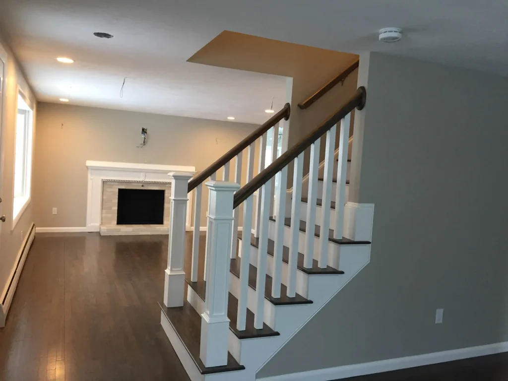 Interior remodel with staircase, hardwood, and fireplace