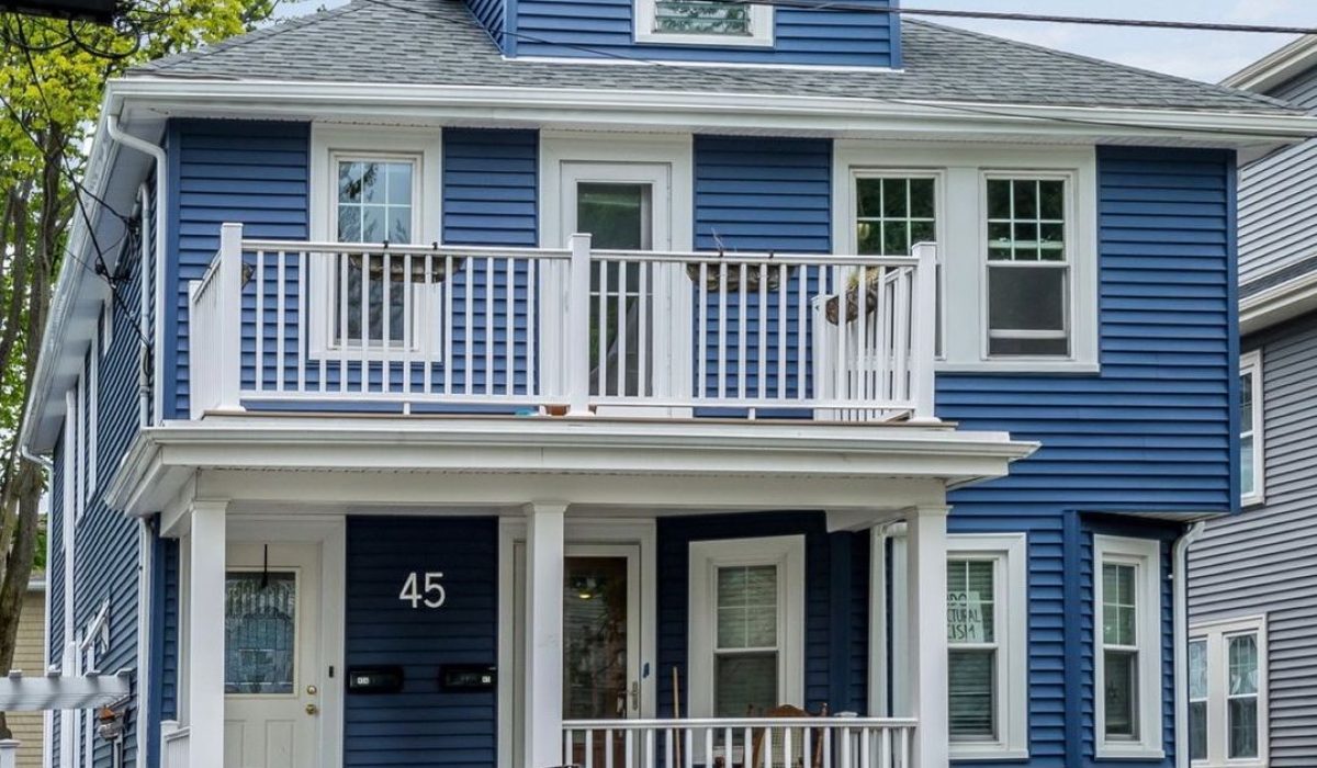 completed certainteed siding project on a blue house in arlington massachusetts
