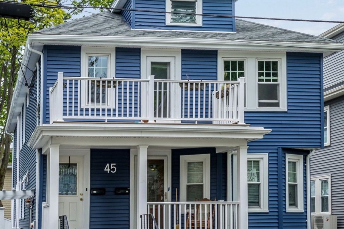 completed certainteed siding project on a blue house in arlington massachusetts