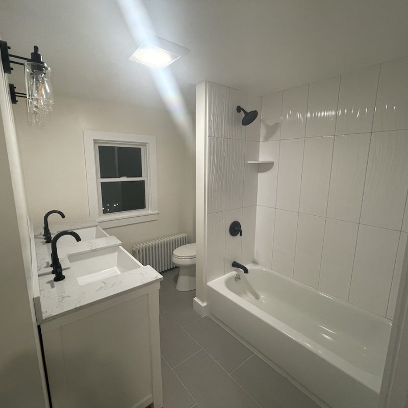 bathroom remodel with toilet shower sink vanity and lighting for home in millis massachusetts by three sons window and more