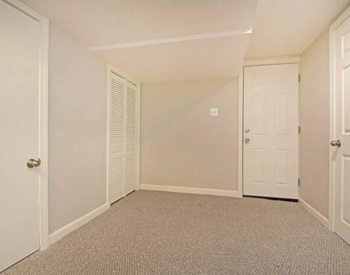 Finished basement hallway with new interior doors
