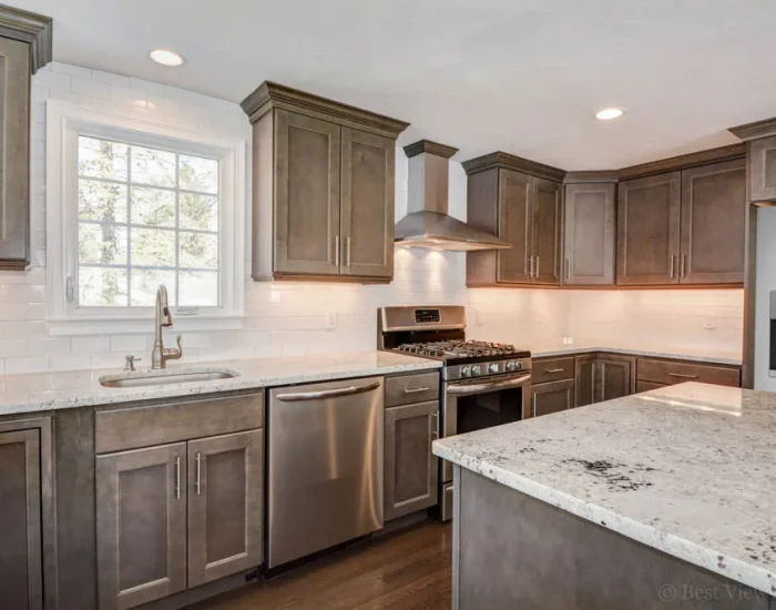 Dark-cabinet kitchen with granite counters and stainless range