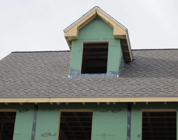 New shingle roof during dormer construction